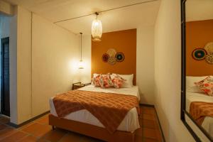 Postel nebo postele na pokoji v ubytování Tres Lagos Hotel