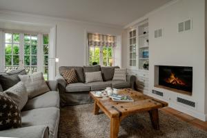 a living room with a couch and a coffee table at LITZKOW 12802 in Morsum
