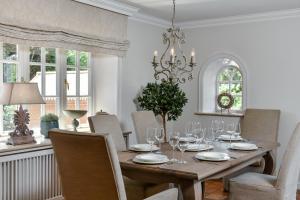a dining room with a table with wine glasses at LITZKOW 15808 in Morsum