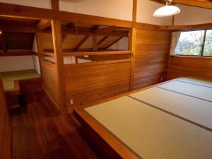 Postel nebo postele na pokoji v ubytování 閑乗寺JoyBase