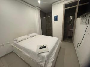 Postel nebo postele na pokoji v ubytování Hotel La Esmeralda