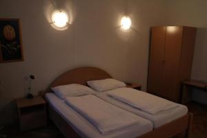 Postel nebo postele na pokoji v ubytování Suite Hotel 200m zum Prater