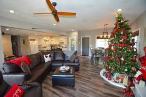 a living room with a christmas tree in it at Ledge House-Lake Area in Bass Lake