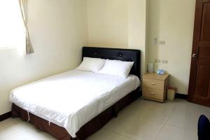 Postel nebo postele na pokoji v ubytování 大新民宿Da Xin Homestay