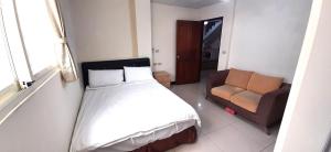 Postel nebo postele na pokoji v ubytování 大新民宿Da Xin Homestay