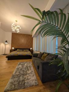 a living room with a couch and a bed at 8 Water Street in Liverpool