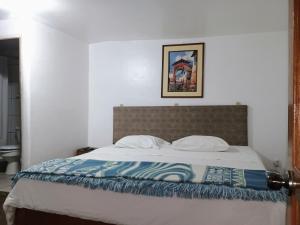 Postel nebo postele na pokoji v ubytování Posada Catama INN