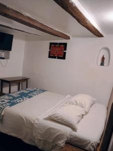 Postel nebo postele na pokoji v ubytování Posada Catama INN