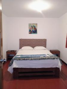 Postel nebo postele na pokoji v ubytování Posada Catama INN