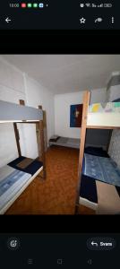 Ένα ή περισσότερα κρεβάτια σε δωμάτιο στο Apollo Hostel