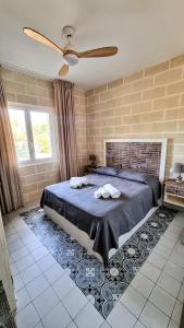 Postel nebo postele na pokoji v ubytování Casa Armonia