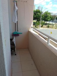 a room with a balcony with a tiled floor and a window at Ap no centro do Vila Branca in Jacareí