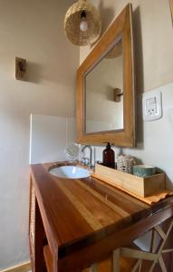 a bathroom with a sink and a mirror at Tinku Huasi Domos Suite in Tilcara
