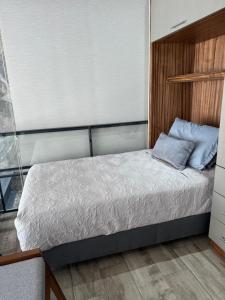 Ένα ή περισσότερα κρεβάτια σε δωμάτιο στο Residencial entre Viñedos +15 φωτογραφίες