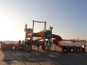 a playground with a slide on the beach at Dijkvilla on the IJsselmeer in Makkum