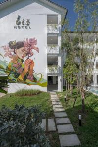 a mural on the side of a building at Lis Hotel Chiangmai in Chiang Mai