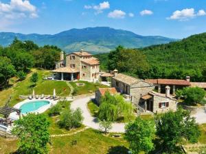 an estate with a large house and a swimming pool at Villa Maccaroni Comfortable holiday residence in Paz