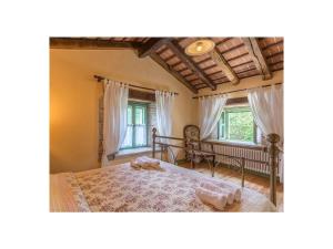 a bedroom with a large bed and a window at Villa Maccaroni Comfortable holiday residence in Paz +32 photos