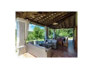 a living room with a couch and a table at Villa Maccaroni Comfortable holiday residence in Paz