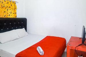 Postel nebo postele na pokoji v ubytování Bima Homestay Puncak RedPartner