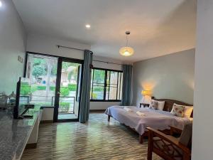 Postel nebo postele na pokoji v ubytování Pim's House Khao Yai