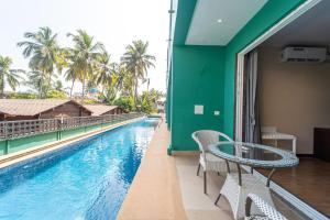 Fotografie z fotogalerie ubytování Treebo Skazka Resort Mandrem Beach with Pool v destinaci Mandrem + 37 fotografií