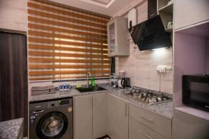 Cuisine ou kitchenette dans l'établissement Agape Villa