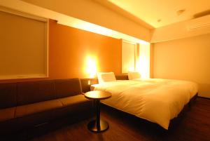 A bed or beds in a room at AB Hotel Kakamigahara