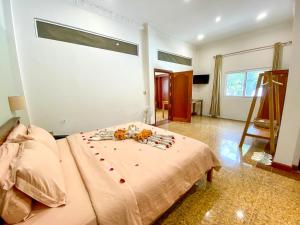 Postel nebo postele na pokoji v ubytování Muni La Maison