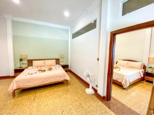 Postel nebo postele na pokoji v ubytování Muni La Maison