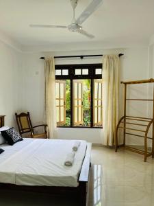 Postel nebo postele na pokoji v ubytování Bernard Homestay