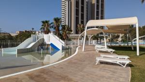 a skate park with a slide and a skate ramp at SUNSET WAVES sea & sky apartment in Benidorm