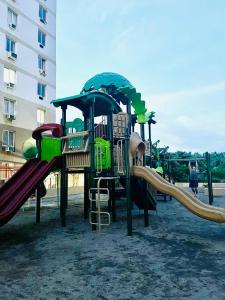 a playground with a slide at Jack's Cabin in Suba