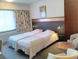 Ένα ή περισσότερα κρεβάτια σε δωμάτιο στο Hotel Falster