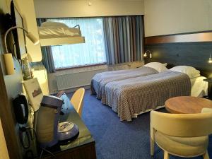 Ένα ή περισσότερα κρεβάτια σε δωμάτιο στο Hotel Falster