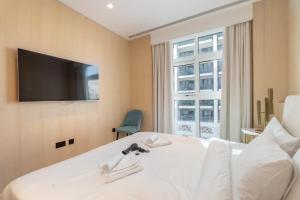 Voodi või voodid majutusasutuse High-end Quality Apartment in FIVE Palm Jumeirah toas