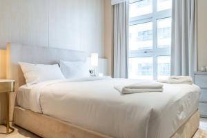 Voodi või voodid majutusasutuse High-end Quality Apartment in FIVE Palm Jumeirah toas