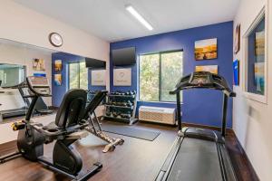 a fitness room with a gym with a treadmill at Comfort Suites St Charles-St Louis in St. Charles