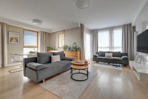 Et opholdsområde på Aura - Riverside & Parking by Downtown Apartments