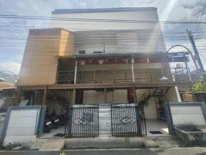 a building with a gate in front of it at Hotel Budget Urban Space - BUS in Semarang