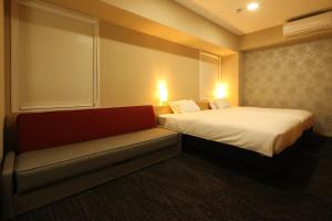 Postel nebo postele na pokoji v ubytování AB Hotel Hikone