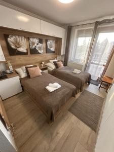 Postel nebo postele na pokoji v ubytování Le Rose Suites & Park Hotel
