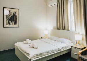 Letto o letti in una camera di Athenian Suite by Zeussuites