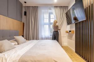 Posteľ alebo postele v izbe v ubytovaní Glow Apartments - Apartamenty Studio KOZIA Gdańsk Śródmieście