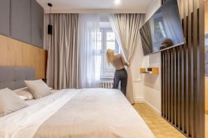 Posteľ alebo postele v izbe v ubytovaní Glow Apartments - Apartamenty Studio KOZIA Gdańsk Śródmieście