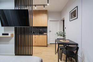 Kuchyňa alebo kuchynka v ubytovaní Glow Apartments - Apartamenty Studio KOZIA Gdańsk Śródmieście