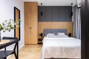 Posteľ alebo postele v izbe v ubytovaní Glow Apartments - Apartamenty Studio KOZIA Gdańsk Śródmieście