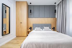 Posteľ alebo postele v izbe v ubytovaní Glow Apartments - Apartamenty Studio KOZIA Gdańsk Śródmieście