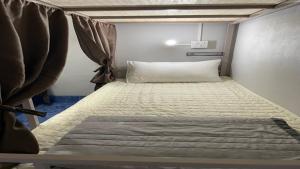 Postel nebo postele na pokoji v ubytování Zou Hostel
