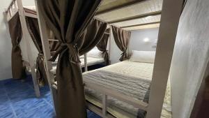 Postel nebo postele na pokoji v ubytování Zou Hostel